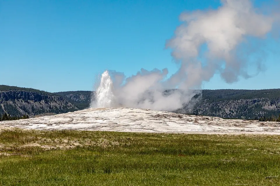 Old Faithful geyser erupting in Yellowstone